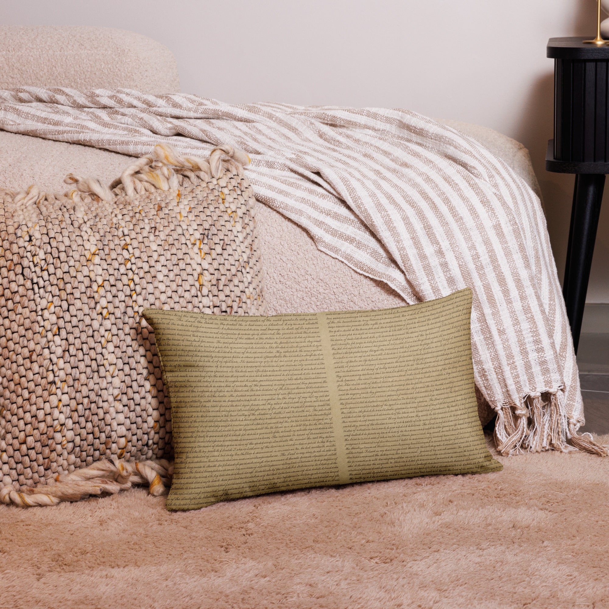 Luxury Comfort Pillow with textured fabric in neutral tones placed on a cozy rug, complemented by a woven cushion and striped throw in a stylish living space.