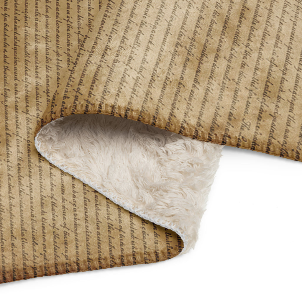 Luxury Sherpa Throw Blanket with a vintage script design on tan fabric and a soft, plush white sherpa lining, perfect for elegant and cozy home decor.