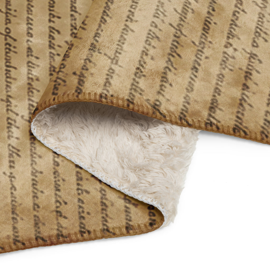 Luxury Sherpa Throw Blanket in tan with vintage script design on one side and soft plush sherpa lining on the reverse, offering warmth and elegant comfort for any home decor.